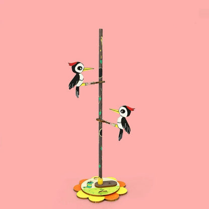 Woodpeckers with Friction and Gravity